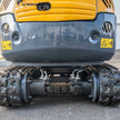 Rear view of heavy duty hydraulic travel motors on Hengwang HW-13W 1.3 ton mini excavator