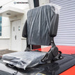 Close-up of the black vinyl operator seat on a 6,500 lb electric forklift, featuring padded backrest, flip-up armrests, and seat suspension mount for all-day warehouse operation comfort.