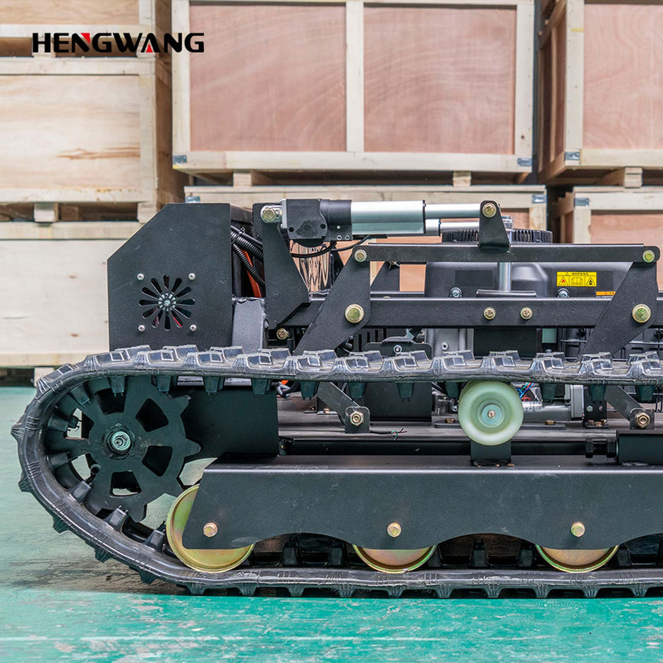 HENGWANG tracked remote lawn mower heavy-duty rubber crawler track chassis close-up, wear-resistant track wheels and metal frame factory detail shot