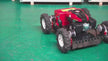 Remote Control Gas Lawn Mower driving across an open grass field with wireless remote operation for efficient lawn maintenance