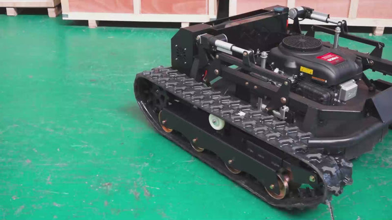 Remote Control Crawler Lawn Mower climbing a steep 45-degree slope with 9HP gasoline engine and tracked drive system