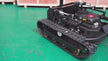 Remote Control Crawler Lawn Mower climbing a steep 45-degree slope with 9HP gasoline engine and tracked drive system