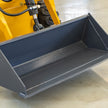 0.12m³ skid steer loader bucket with heavy-duty hydraulic lift arm for material handling on farms and construction jobsites