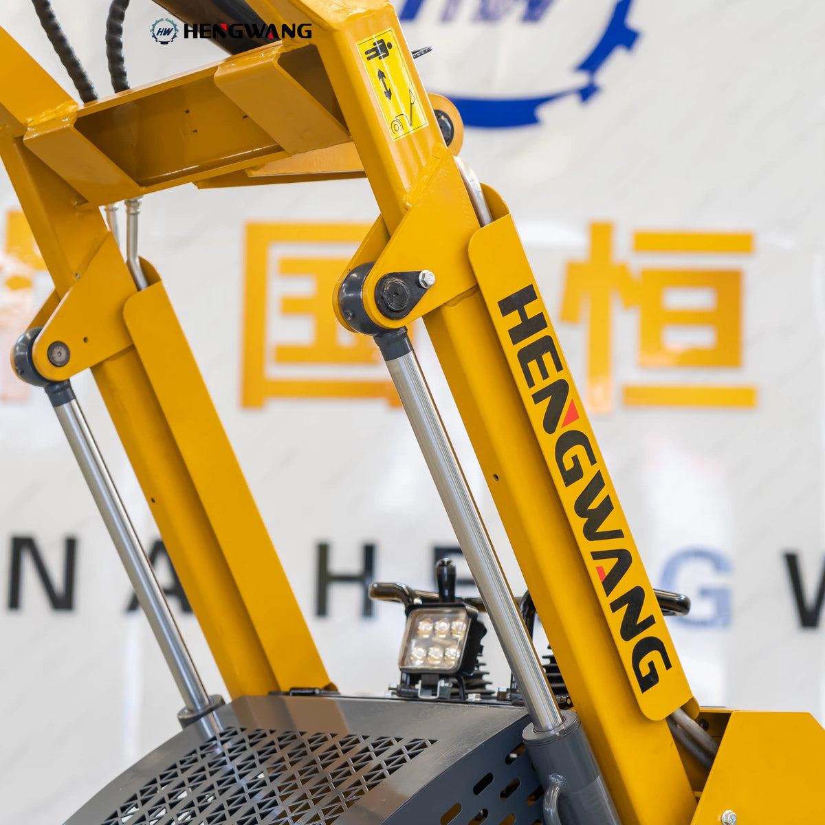 High-lift hydraulic arm of the skid steer loader reaching 1,870 mm pin height for easy loading and dumping in tight work areas