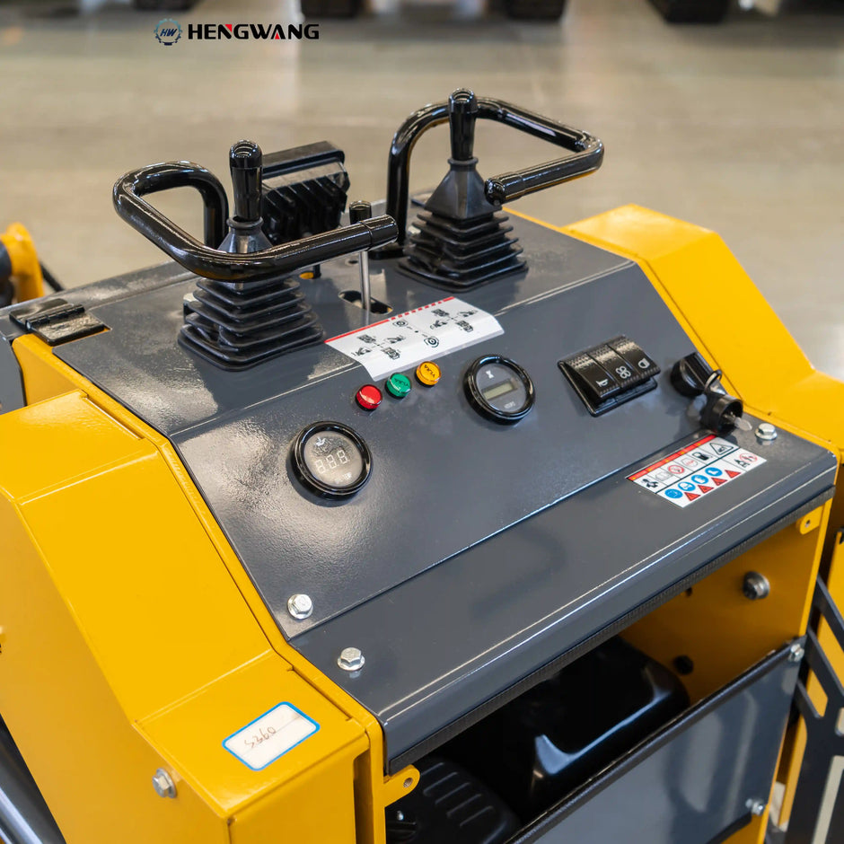 Skid steer loader operator station with dual joystick controls, oil temperature gauge and hour meter for easy, precise operation