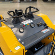 Skid steer loader operator station with dual joystick controls, oil temperature gauge and hour meter for easy, precise operation