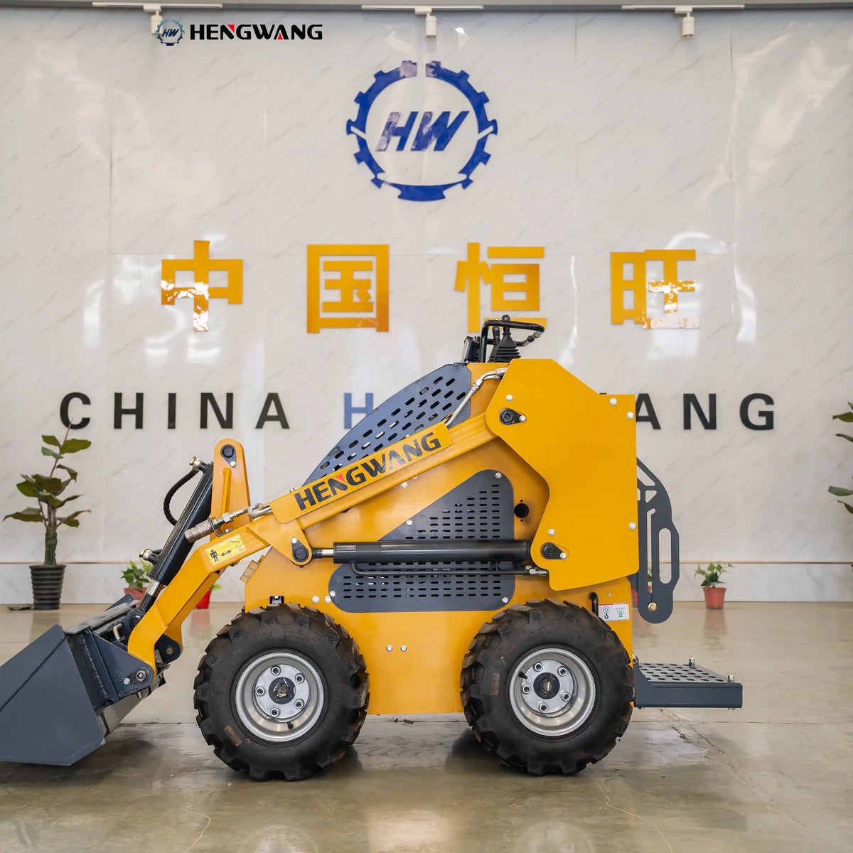 Compact skid steer loader left side view with a tight 2,070 mm footprint and heavy-duty tires, built for narrow construction sites